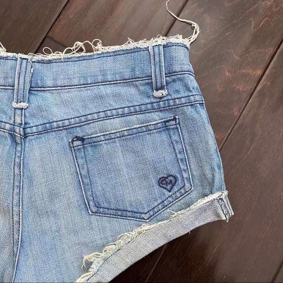Mid Rise Medium Wash Blue Cheeky Denim Shorts - Picture 4 of 4